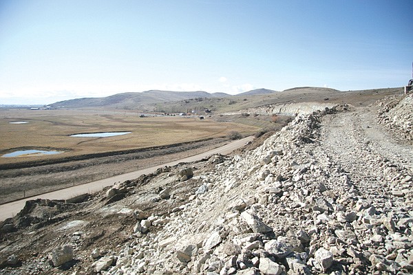 Looking south from a rock cut on Back Road. The project is using rock to stabilize the road foundation before paving, which project manager Clayton Forsman hopes to have completed by the end of the year.