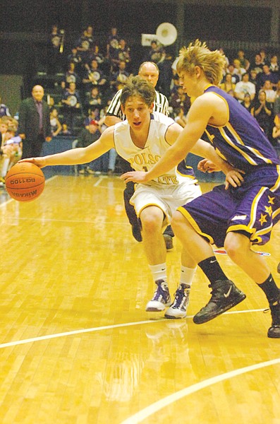 Polson sophomore Vince DiGiallonardo protects the ball from a Laurel defender during the first half of the Class A championship game.