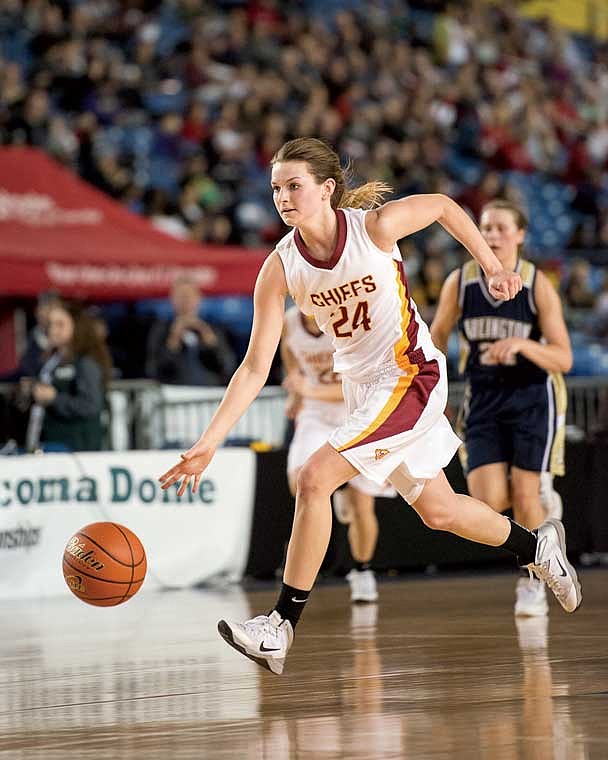 Moses Lake senior Emily Olson drives to the basket for two points in the state quarterfinals against Arlington at the Tacoma Dome. Moses Lake advanced to the semifinals with a 46-28 win.