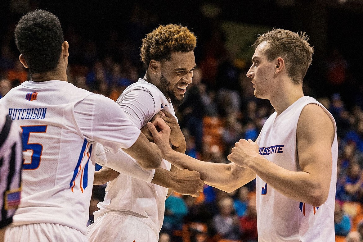&lt;p&gt;SHAWN GUST/Press James Webb III is congratulated by teammates Chandler Hutchison, left, and Anthony Drmic after drawing a foul while scoring against UC Davis.&lt;/p&gt;