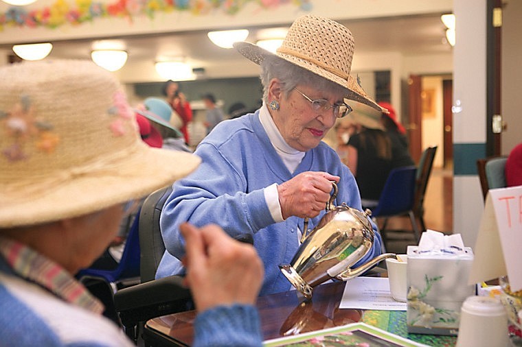 Ellie Brandau pours herself some tea.