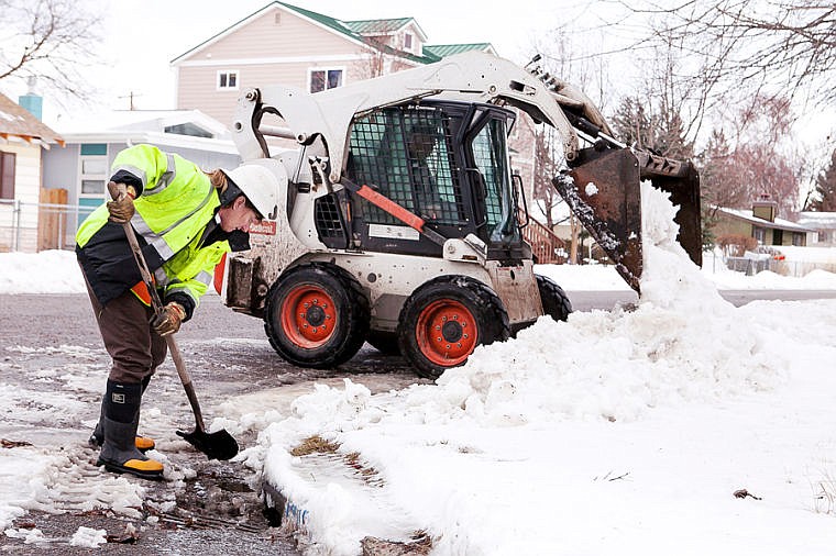 &lt;p&gt;City of Kalispell workers clear snow from blocked storm drains Thursday afternoon along 13th Street. March 6, 2014 in Kalispell, Montana. (Patrick Cote/Daily Inter Lake)&lt;/p&gt;