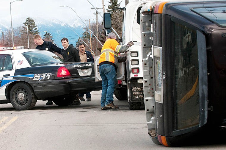 &lt;p&gt;A man is arrested Friday afternoon after his car rolled in a collision with a van at the intersection of Center Street and Second Avenue East in Kalispell. March 7, 2014 in Kalispell, Montana. (Patrick Cote/Daily Inter Lake)&lt;/p&gt;