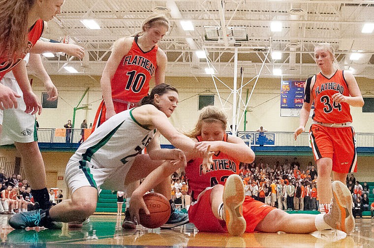 &lt;p&gt;Flathead senior Jenessa Heine (43) and Glacier senior center Cassi Hashley (left) fight for a loose ball Friday night during the second half of Glacier&#146;s Western AA state play-in basketball victory over Flathead at Glacier High School.&#160;&lt;/p&gt;