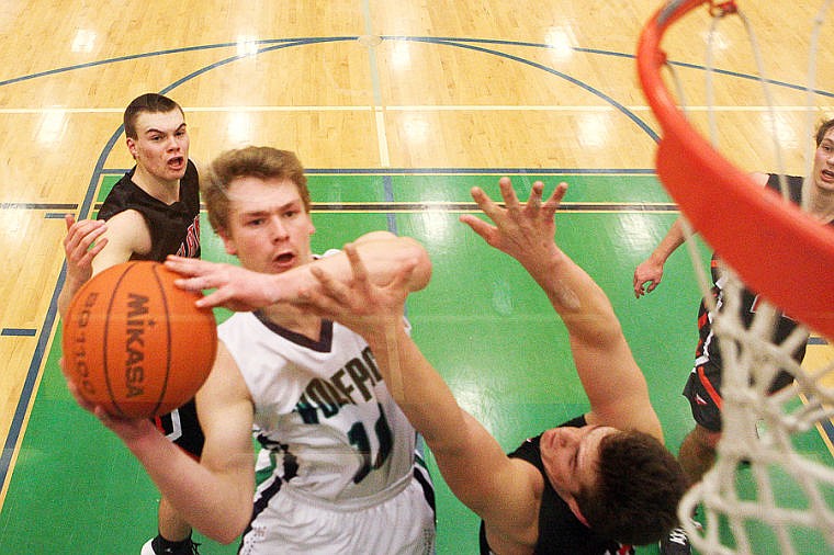 &lt;p&gt;Glacier senior guard Evan Epperly goes up for a shot over Flathead senior Blaine Newman Friday night during Western AA state play-in basketball action at Glacier High School.&#160;&lt;/p&gt;