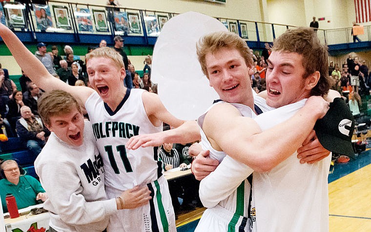 &lt;p&gt;Glacier senior wing Bryan Michaels (11) and senior guard Evan Epperly celebrate with fans Friday night after Glacier&#146;s Western AA state play-in basketball victory over Flathead at Glacier High School.&#160;&lt;/p&gt;