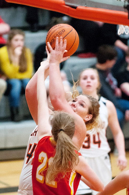 &lt;p&gt;Flathead senior Jenessa Heine is fouled as she puts up a shot Tuesday night during Flathead's victory over Hellgate at Flathead High School. March 4, 2014 in Kalispell, Montana. (Patrick Cote/Daily Inter Lake)&lt;/p&gt;