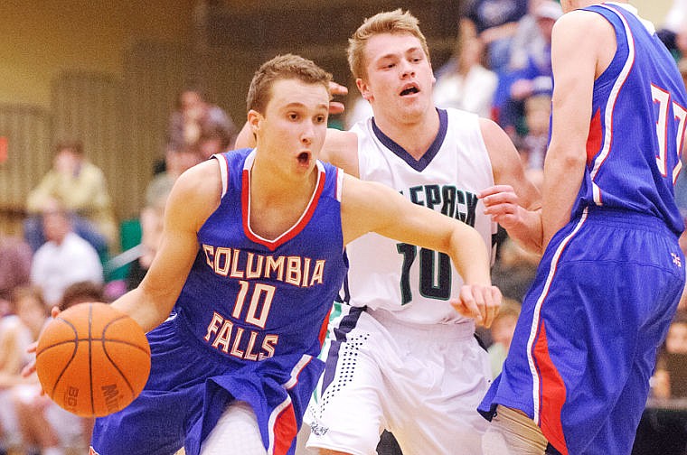 &lt;p&gt;Columbia Falls senior Alex Presnell (left) drives past Glacier senior Evan Epperly Thursday night during Glacier's matchup against Columbia Falls at Glacier High school. Jan. 16, 2014 in Kalispell, Montana. (Patrick Cote/Daily Inter Lake)&lt;/p&gt;