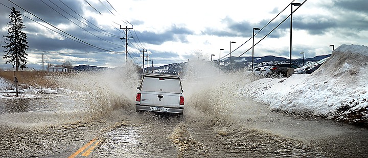 &lt;p&gt;A truck drives through water covering Willow Glen Drive on Thursday morning, March 6, in Kaispell. (Brenda Ahearn/Daily Inter Lake)&lt;/p&gt;