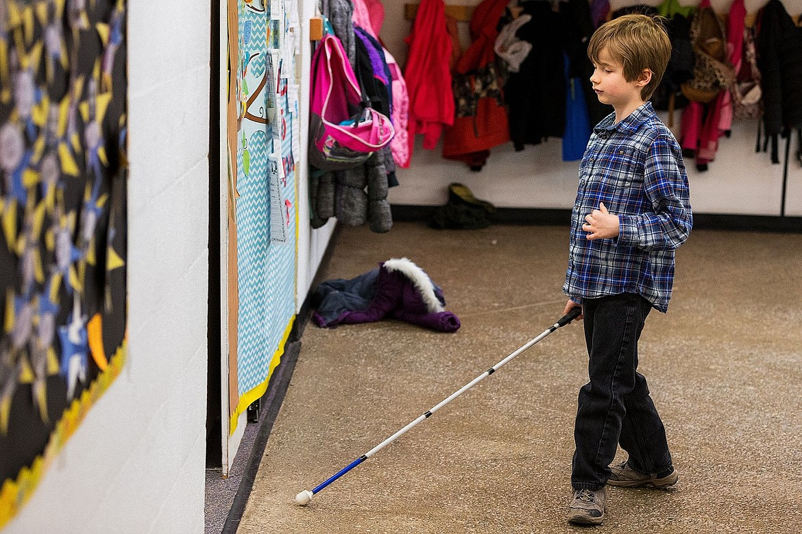 &lt;p&gt;Alex Owens, a second-grade student at Ponderosa Elementary, who is blind, uses his cane to navigate through the halls of the school on the way to math class.&lt;/p&gt;