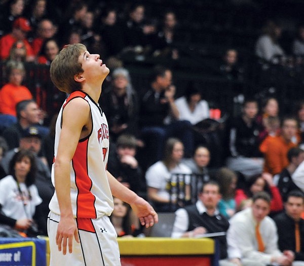 Flathead's Joe Pistorese looks up at hte scoreboard, which sits above the gym at half court, in the second quarter. Bozeman outscored Flathead 29-12 in the period.