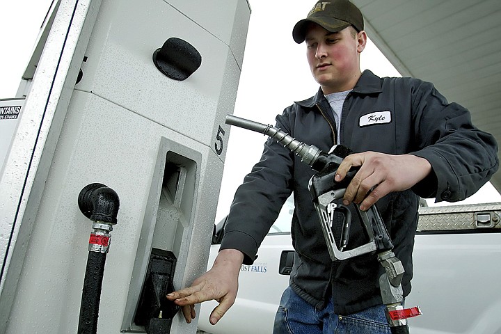 &lt;p&gt;Kyle Rickard, a City of Post Falls employee, replace the gas pump handle after filling one of the fleet vehicle for the city Thursday. Rising gas prices have prompted the City of Post Falls to consider natural gas options for their fleet vehicles.&lt;/p&gt;