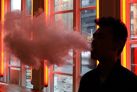 &lt;p&gt;A patron exhales vapor from an e-cigarette at the Henley Vaporium in New York, Feb. 20, 2014.&lt;/p&gt;