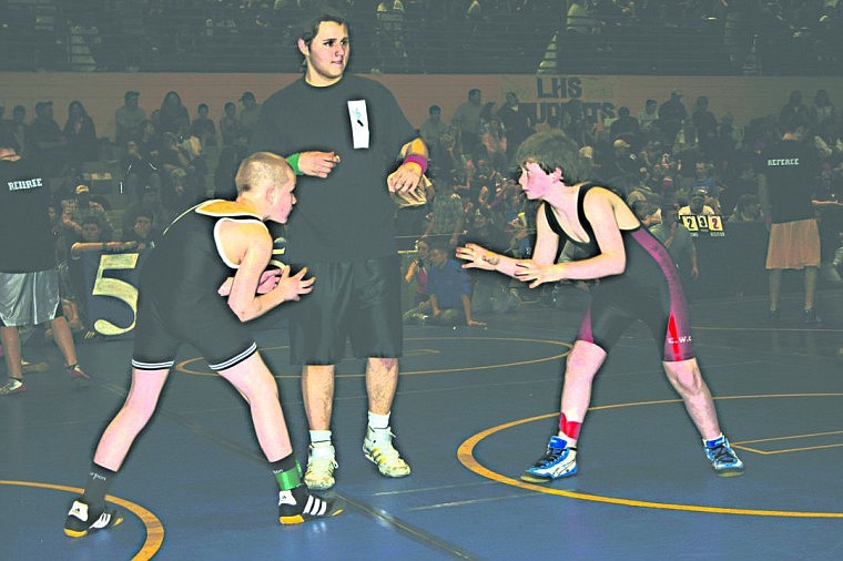 Matthew McCracken, of the Plains Little Guy Wrestling team, takes on Austin Greene, of the Columbia Falls Little Guy team. McCracken won the match 17-10 after coming from behind 10-1 and then tying it 10-10 before taking the lead.