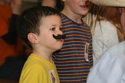 Nick Ianniello/Mineral Independent Alberton reading deputy, Parker Radford sports his brand new mustache he received for his reading achievements in the month of February. Alberton students got together last Tuesday morning to celebrate the end of the month-long reading challenge.