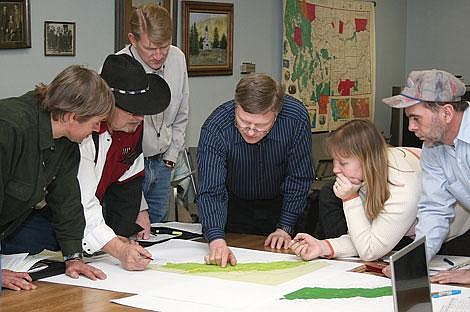 Photo by Nick Ianniello Mineral County Planner Tim Read points to areas that need flood plain re-mapping at a meeting with Mineral County commissioners Tuesday. The meeting discussed a nationwide project funded by FEMA that will help re-map flood plain areas in Mineral County.