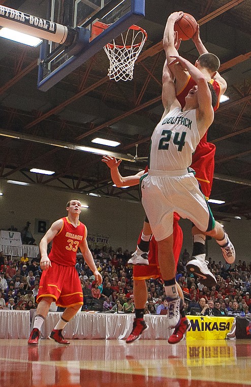 <p>Glacier senior forward Logan Iverson (24) battles for a rebound Friday afternoon during Glacier's matchup against Hellgate on the second day of the Class AA state basketball tournament at Four Seasons Arena in Great Falls. Friday, March 8, 2013 in Great Falls, Montana. (Patrick Cote/Daily Inter Lake)</p>