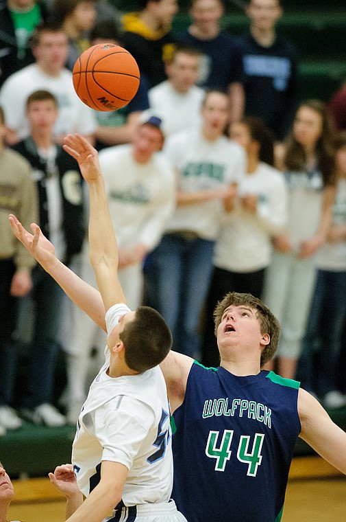 <p>Glacier senior post Ryan Edwards (44) goes up for the tip off Saturday morning during Glacier's matchup against Great Falls High on the third day of the Class AA state basketball tournament at C.M. Russell High School in Great Falls. Saturday, March 9, 2013 in Great Falls, Montana. (Patrick Cote/Daily Inter Lake)</p>