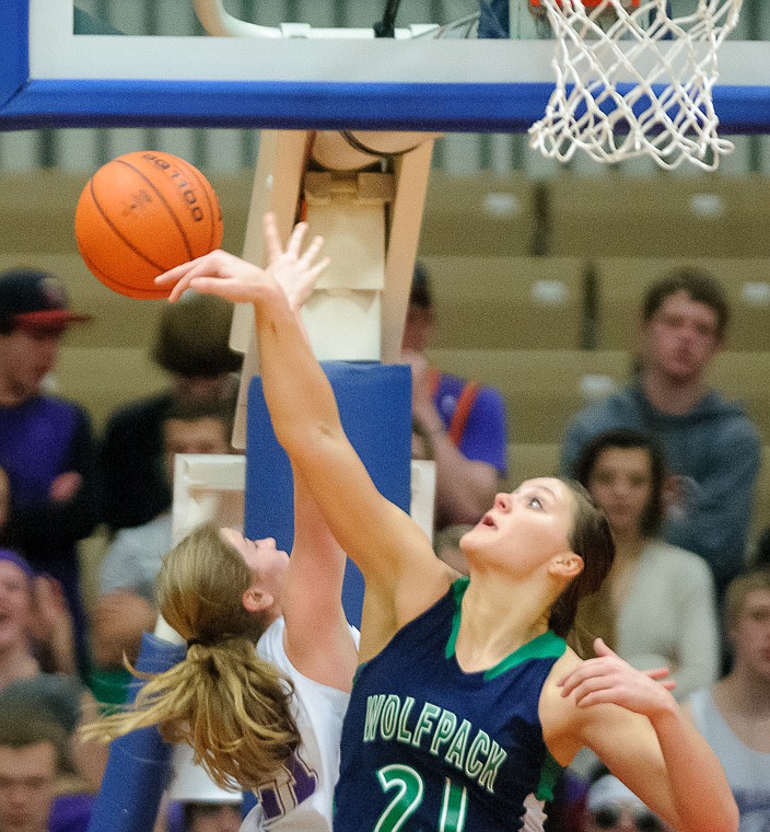 <p>Glacier junior center Cassidy Hashley (21) blocks a shot Thursday afternoon during the second half of Glacier's loss to Butte in the first game of the Class AA State Championship in Great Falls. Thursday, March 7, 2013 in Great Falls, Montana. (Patrick Cote/Daily Inter Lake)</p>