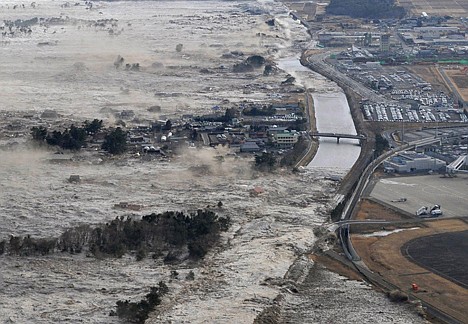 &lt;p&gt;Earthquake-triggered tsunamis sweep shores along Iwanuma in northern Japan on Friday. The magnitude 8.9 earthquake slammed Japan's eastern coast, unleashing a 13-foot tsunami.&lt;/p&gt;