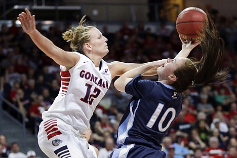 &lt;p&gt;Gonzaga's Taelor Karr (12) attempts to block a reverse layup by San Diego's Amy Kame during the first half of Monday's West Coast Conference tournament in Las Vegas.&lt;/p&gt;