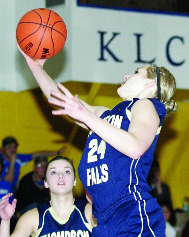Hope Reid goes up for a rebound at the district tournament in Libby.