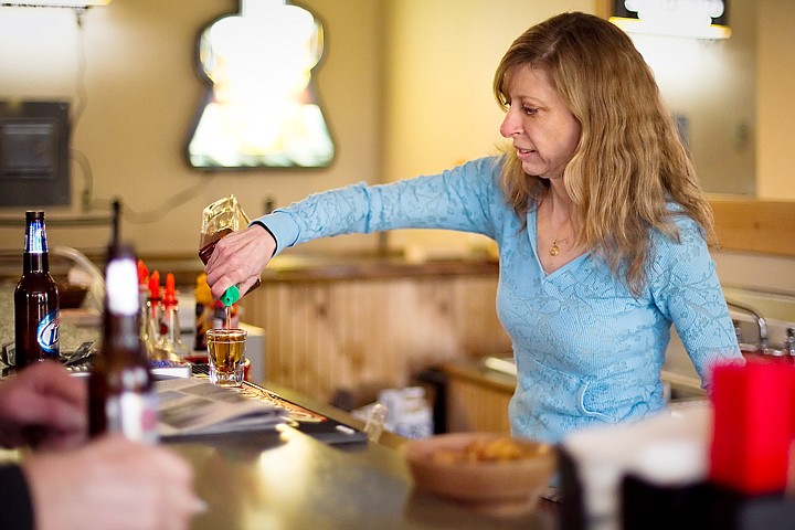 &lt;p&gt;Sheree Greenfield, co-owner of Kelsey's in Rathdrum, pours a shot for a patron Monday at the bar that opened in January.&lt;/p&gt;