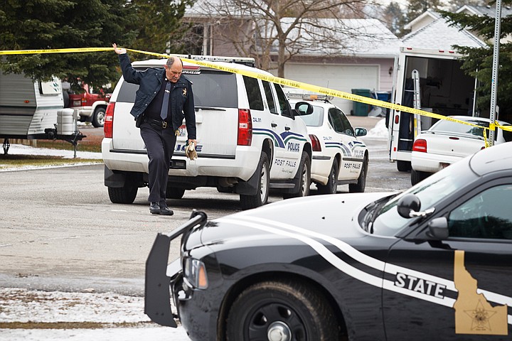 &lt;p&gt;SHAWN GUST/Press Capt. Curtis Kastens with the Idaho State Police lifts the police line tape Monday during an investigation at the scene where police opened fire on a suspect near the intersection of Bordeaux Avenue and St. Estephe Court in Hayden.&lt;/p&gt;