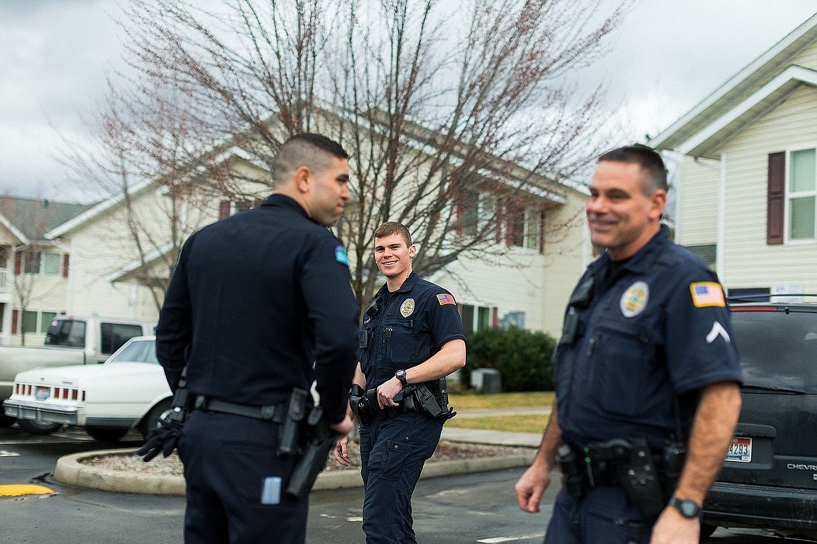 &lt;p&gt;SHAWN GUST/Press Post Falls Police Officer Alex Clark interacts with Ben Kirkendall, an officer-in-training, left, and Field Training Officer JD Putnam, right, following a service call Thursday in Post Falls.&lt;/p&gt;