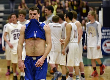 <p>Bigforks Adam Jordt walks off the court after the Vikings loss to the Choteau Bulldogs 67-59 in the Class B State Championship at the Butte Civic Center on Saturday. (Aaric Bryan/Daily Inter Lake)</p>