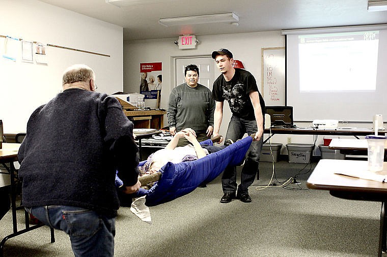 &lt;p&gt;Attendees built a litter made out of a sleeping bag and poles to be used to carry an injured person.&lt;/p&gt;