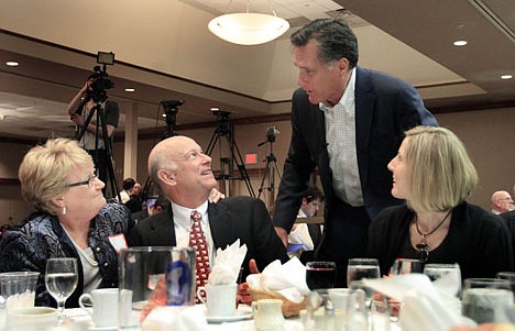 &lt;p&gt;Former Massachusetts Gov. MItt Romney works the tables like a presidential candidate Sunday in Bartlett, N.H, where he was the keynote speaker at the Carroll County Republican Committee Lincoln Day Dinner.&lt;/p&gt;