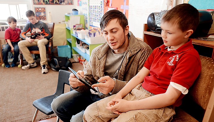 &lt;p&gt;Flathead High School senior Vladimir Kigilyuk reads with St. Matthew&#146;s first grader Noah Sonju.&lt;/p&gt;