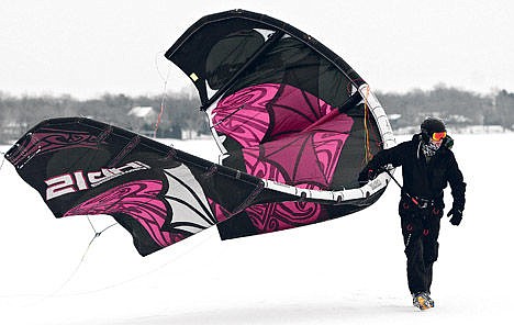 &lt;p&gt;Rick Russell walks with his kite while snowkiting on Pearl Lake near Marty, Minn., Feb. 20.&lt;/p&gt;