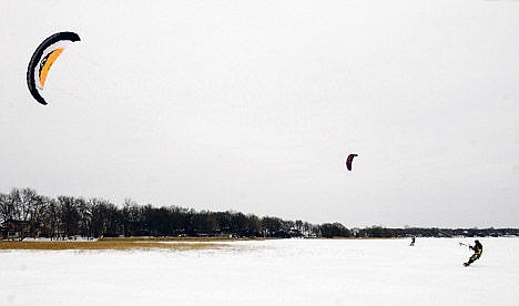 &lt;p&gt;Jerry Sandell and Rick Russell snow kite on Pearl Lake near Marty, Minn., Feb. 20.&lt;/p&gt;