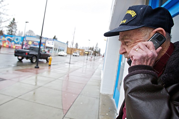 &lt;p&gt;JEROME A. POLLOS/Press Earl Crain talks on his cell phone Tuesday outside the American Legion Hall in Midtown Coeur d'Alene across from where a proposed apartment complex is being considered. With the last round of Midtown renovations, American Legion Hall lost parking space located in front of its building. &quot;They messed with everything and then promised a signal at the crosswalk and I don't think we'll ever see that done,&quot; Crain said.&lt;/p&gt;