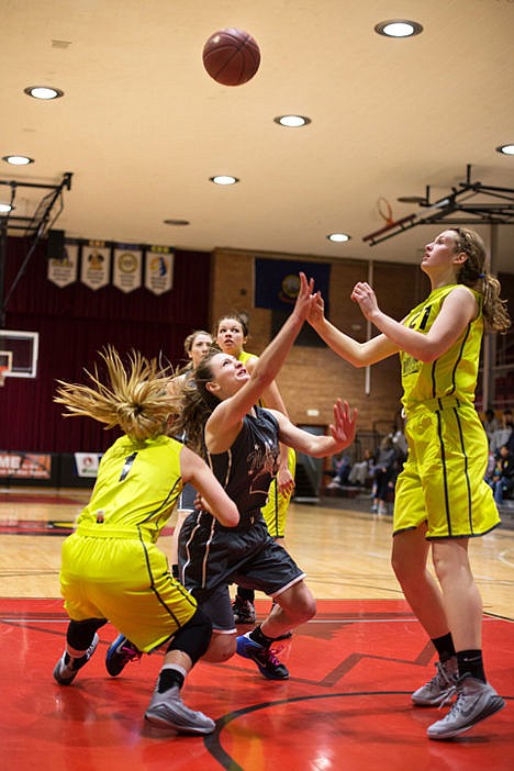<p>Lake City High School's Natalie Wheelock attempts a shot as she falls to the ground on Saturday at the 12th Annual Idaho High School North vs. South All Star Game held at North Idaho College.</p>