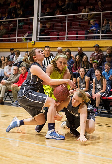 <p>Anna Verhaeghe, left, of Coeur d'Alene Charter Academy, Lynzee Wilson, right, of Lewiston High, and Kaylee Olson of Challis High collide as they scramble for the ball during the girls All Star Game.</p>