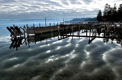 The sun peeks through the clouds, creating striped patterns across Flathead Lake at the marina in Lakeside. A recent ruling could change the water appropriation process in the Clark Fork River basin including Flathead Lake. Jennifer DeMonte/Daily Inter Lake