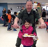 Emergency responders serve breakfast at North