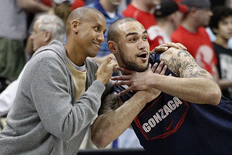 &lt;p&gt;Gonzaga's Robert Sacre, right, mugs with former NBA player Reggie Miller courtside after basketball practice in Pittsburgh, Wednesday, March 14, 2012. Gonzaga plays against West Virginia an East Regional NCAA tournament second-round college basketball game on Thursday. (AP Photo/Keith Srakocic)&lt;/p&gt;