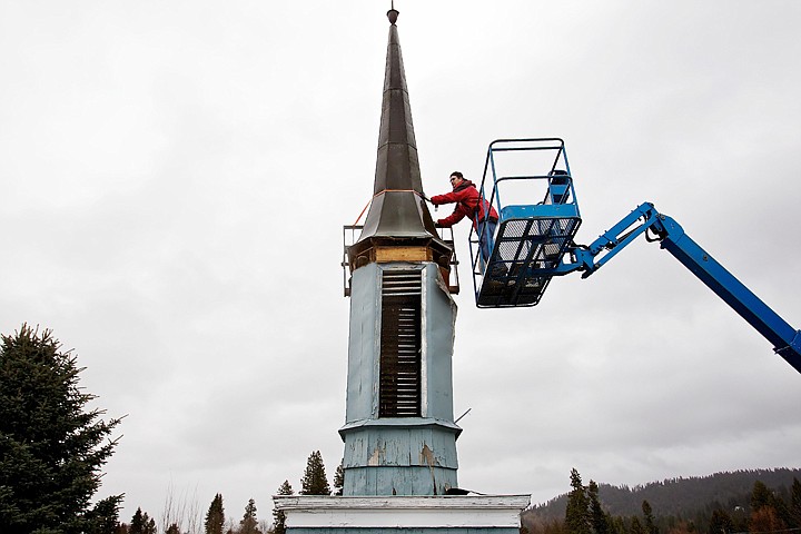 &lt;p&gt;Cody Pearson, owner of Advanced Roofing &amp; Construction, attaches a strap to the steeple of the Lake City Playhouse in Coeur d'Alene in preparation to remove it from the building Tuesday. Pearson is donating about $30,000 in construction services along with other contractors taking part in the renovation project to minimize the cost for the non-profit community theater.&lt;/p&gt;