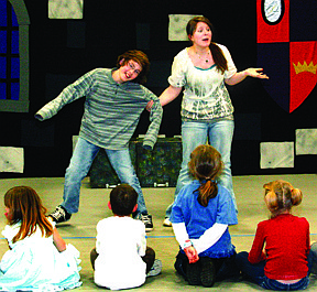 Cast members of the &quot;Snow White and the Seven Dwarfs&quot; production rehearse the play on Friday afternoon in the Plains High School gym.  The play is put on by the Missoula Children's Theatre.  Left, Brandon Garrison plays King &quot;Backwords&quot; and Darcy Ryan plays Snow White.