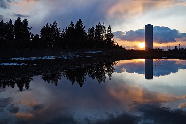 &lt;p&gt;SHAWN GUST/Press The sunset is reflected in a pool of rainwater Monday after stormy skies break over the Rathdrum Prairie.&lt;/p&gt;