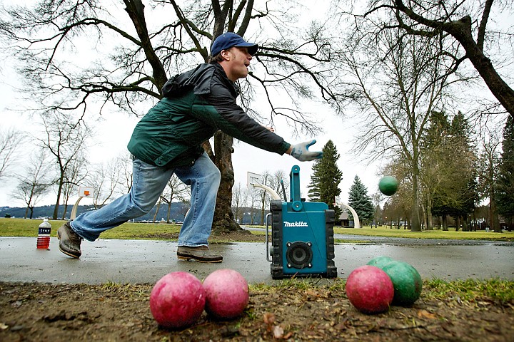 &lt;p&gt;JEROME A. POLLOS/Press Don Enlow tosses a ball down the pathway during a game of open bocce ball Thursday in City Park. Enlow and his friend Mick Arzola typically play frisbee golf, but the weather conditions were more favorable to a roaming game of bocce ball.&lt;/p&gt;