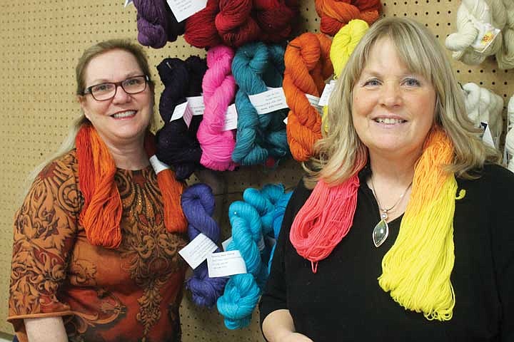 World Wide Yarns owner Debra Gravelle, left, and fiber artist Kim Graham, right, recently launched their line of hand-dyed yarns. Groovy Gals Yarns will be sold exclusively at the Soap Lake shop.