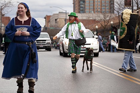 &lt;p&gt;Heath Wiltse walks along with this dog Saturday Afternoon as he follows the Saint Patricks Day parade rout.&lt;/p&gt;