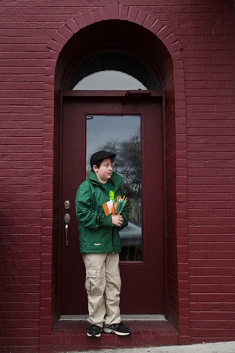 &lt;p&gt;Before the Saint Patricks Day Parade Saturday afternoon, Daniel Oyler, 12, finds shelter from the rain in a doorway while handing out Irish flags to passers by.&lt;/p&gt;