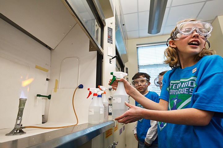 &lt;p&gt;SHAWN GUST/Press Carissa Gallegos, a fifth-grader with the Techno Tornadoes, reacts to color of an open flame changing after spraying it with a sodium solution Monday in a lab at North Idaho College. The newly formed 4-H robotics club visited the lab to learn about how chemistry relates to light and color for a better understanding of the light and ultra-sonic sensors that were in used in their state winning robot.&lt;/p&gt;