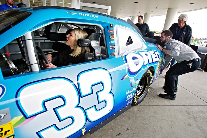 &lt;p&gt;JEROME A. POLLOS/Press Tanna Kluss, the human resources manager for the Coeur d'Alene Fred Meyer, keeps an eye on her &quot;crew&quot; from the driver's seat of the Daytona 500 Oreo NASCAR race car Wednesday as it's moved inside of the store for display. Kraft Foods coordinated the display to celebrate Oreo's 100th anniversary. The car will be displayed today at Safeway on Neider Avenue and at Super 1 Foods on Kathleen Aveneue on Friday.&lt;/p&gt;